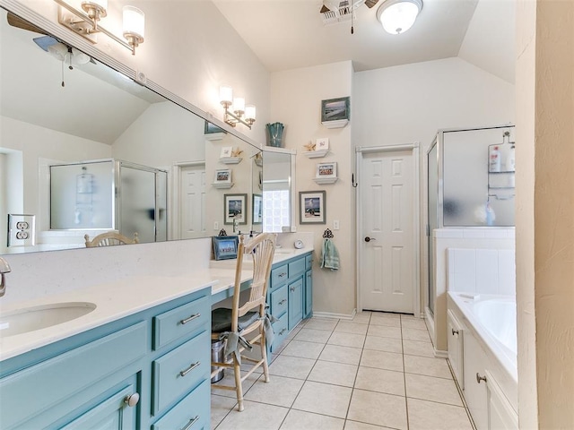 bathroom with tile patterned flooring, visible vents, lofted ceiling, a stall shower, and vanity