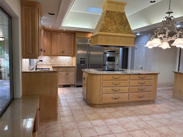 2001 Woodhill Rd, Edmond, OK 73025 - kitchen featuring a center island, built in refrigerator, tasteful backsplash, island exhaust hood, and a notable chandelier
