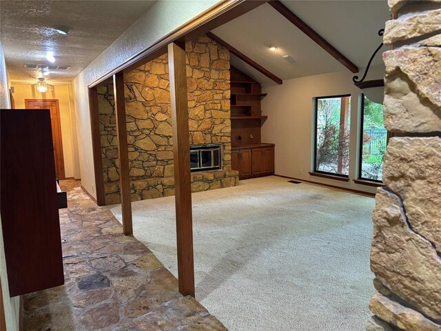 2001 Woodhill Rd, Edmond, OK 73025 - interior space with a fireplace, vaulted ceiling with beams, carpet, and visible vents