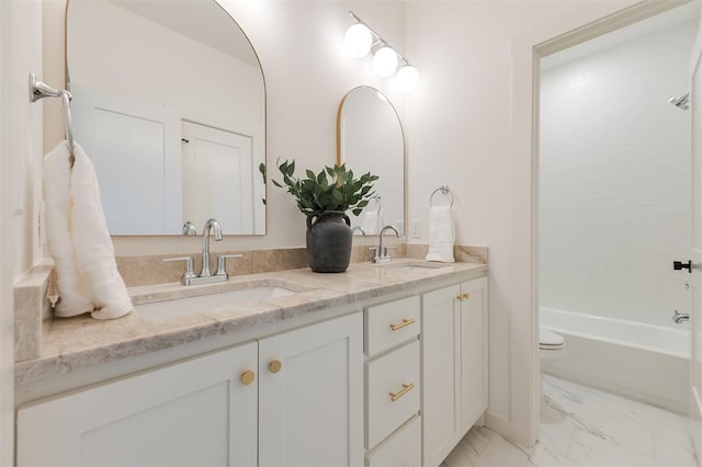 full bath with marble finish floor, shower / tub combination, double vanity, and a sink