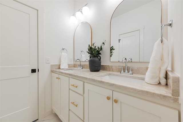 bathroom with double vanity and a sink