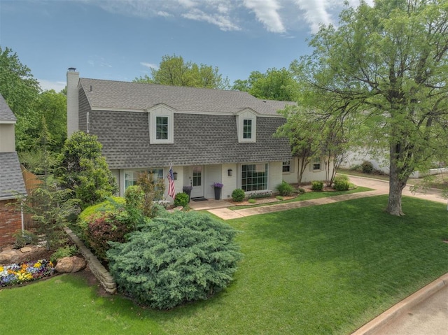 10912 Willow Grove Rd, Oklahoma City, OK 73120 - colonial inspired home featuring a chimney, a front yard, and roof with shingles