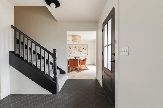 10912 Willow Grove Rd, Oklahoma City, OK 73120 - entrance foyer featuring baseboards, stairway, and wood finished floors