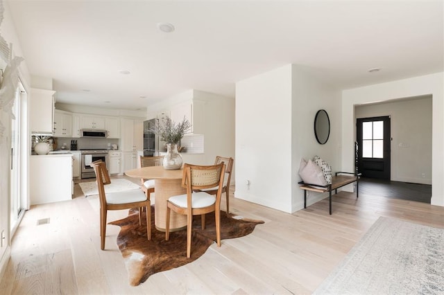 10912 Willow Grove Rd, Oklahoma City, OK 73120 - dining room with light wood-style floors and baseboards