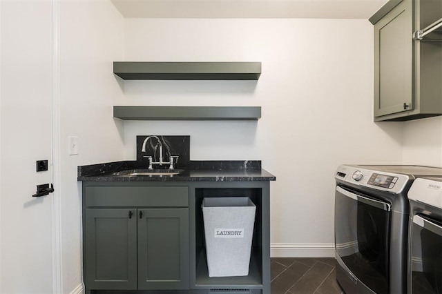 10912 Willow Grove Rd, Oklahoma City, OK 73120 - laundry area with washer and dryer, baseboards, cabinet space, and a sink