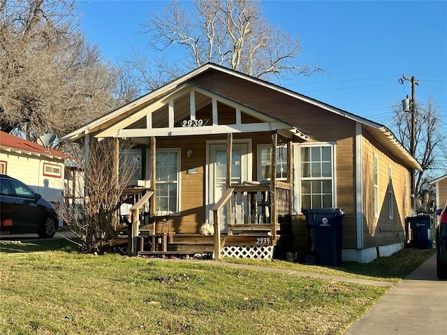 2929 NW 12th St, Oklahoma City, OK 73107 - bungalow-style house with a porch and a front lawn
