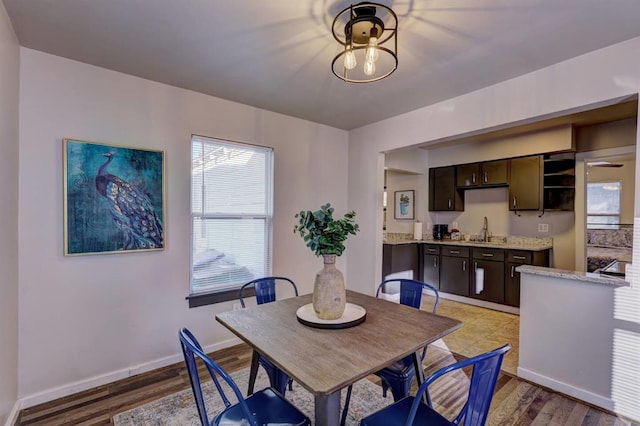 2929 NW 12th St, Oklahoma City, OK 73107 - dining area with light wood-style flooring and baseboards