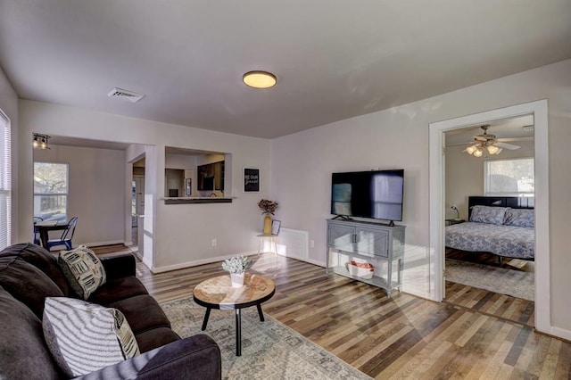 2929 NW 12th St, Oklahoma City, OK 73107 - living room with visible vents, a healthy amount of sunlight, and wood finished floors