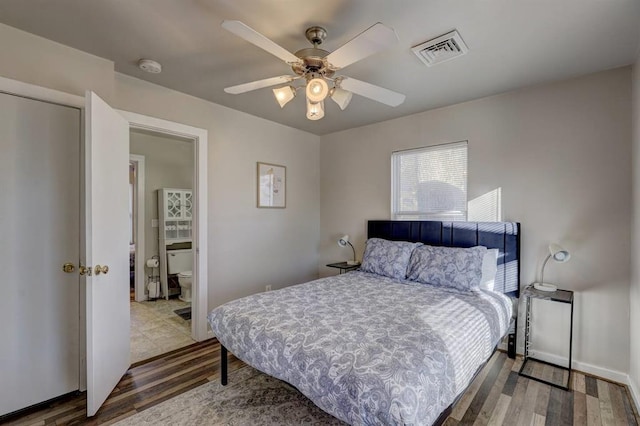 2929 NW 12th St, Oklahoma City, OK 73107 - bedroom with visible vents, wood finished floors, and a ceiling fan