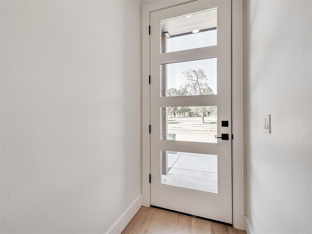 8 S Howard St, Edmond, OK 73003 - entryway with light wood-type flooring and baseboards