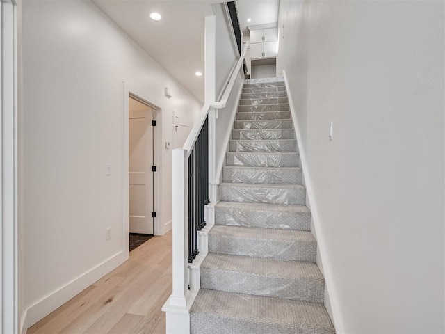 8 S Howard St, Edmond, OK 73003 - stairs featuring recessed lighting, baseboards, and wood finished floors