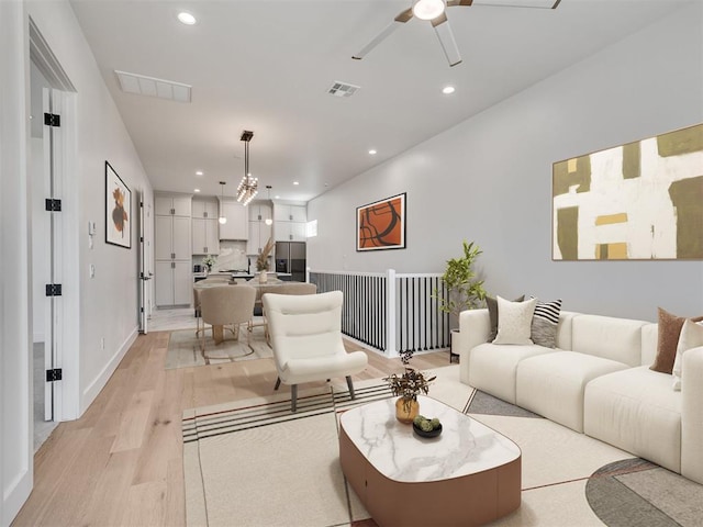 8 S Howard St, Edmond, OK 73003 - living room with recessed lighting, light wood-style floors, and visible vents