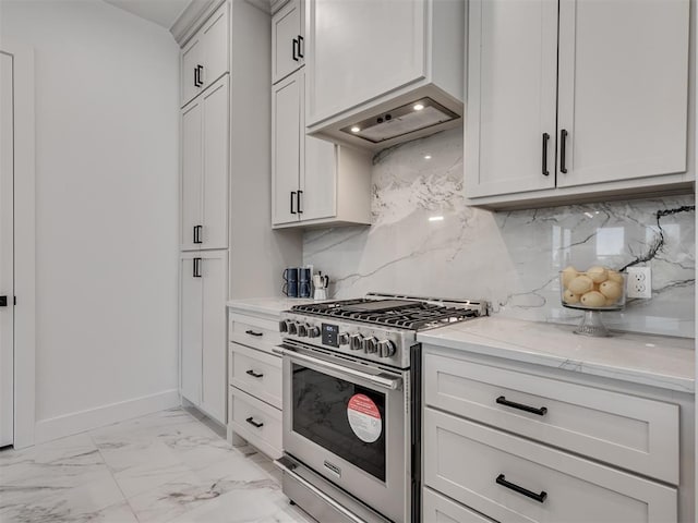 8 S Howard St, Edmond, OK 73003 - kitchen with backsplash, baseboards, light stone counters, high end stainless steel range oven, and marble finish floor