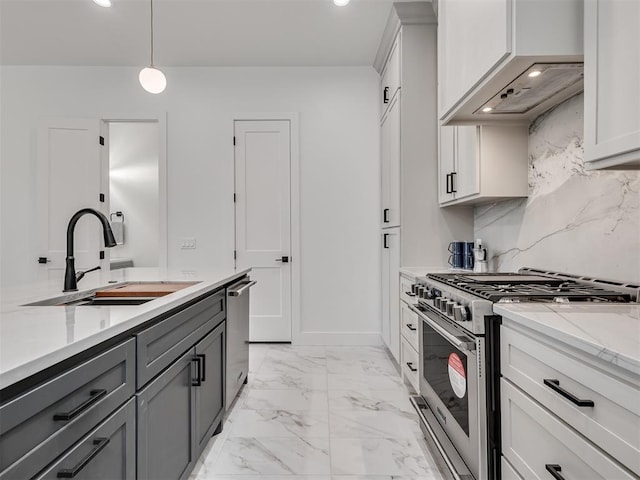 8 S Howard St, Edmond, OK 73003 - kitchen featuring marble finish floor, gray cabinets, a sink, appliances with stainless steel finishes, and decorative backsplash