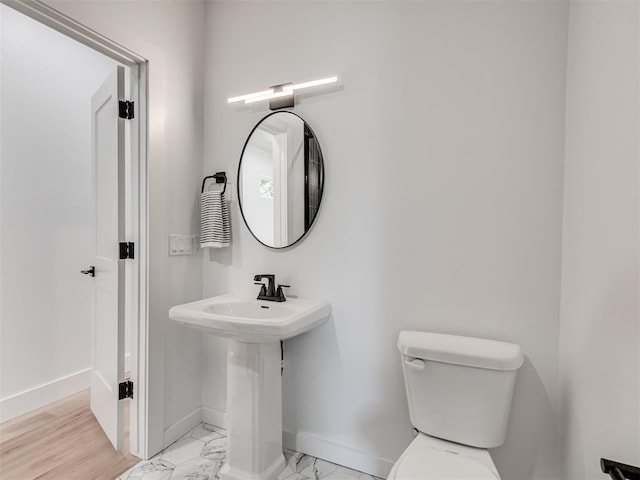 8 S Howard St, Edmond, OK 73003 - bathroom featuring marble finish floor, toilet, and baseboards