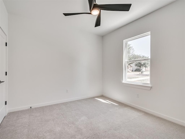 8 S Howard St, Edmond, OK 73003 - carpeted spare room with baseboards and ceiling fan