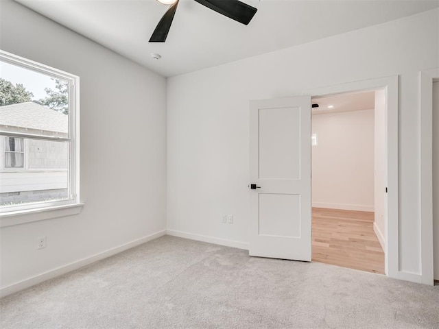 8 S Howard St, Edmond, OK 73003 - carpeted empty room featuring baseboards and ceiling fan