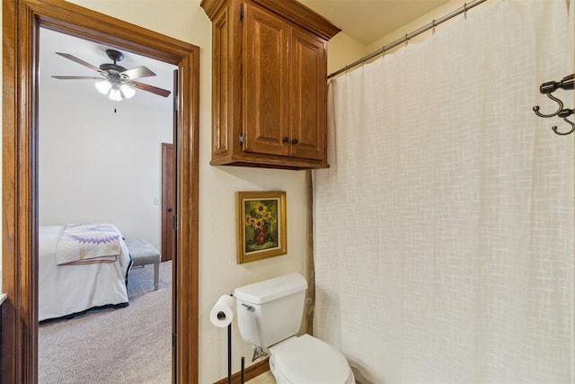 1216 Camelot Dr, Yukon, OK 73099 - bathroom with toilet, a ceiling fan, ensuite bathroom, and curtained shower