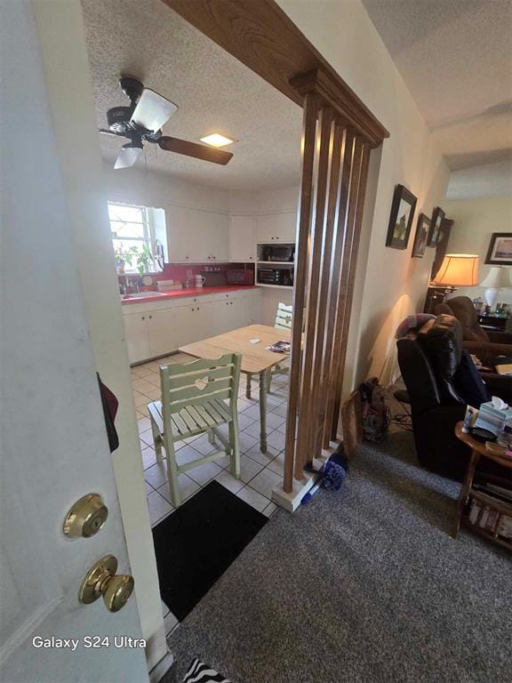 506 E Oklahoma St, Walters, OK 73572 - dining area featuring ceiling fan and a textured ceiling