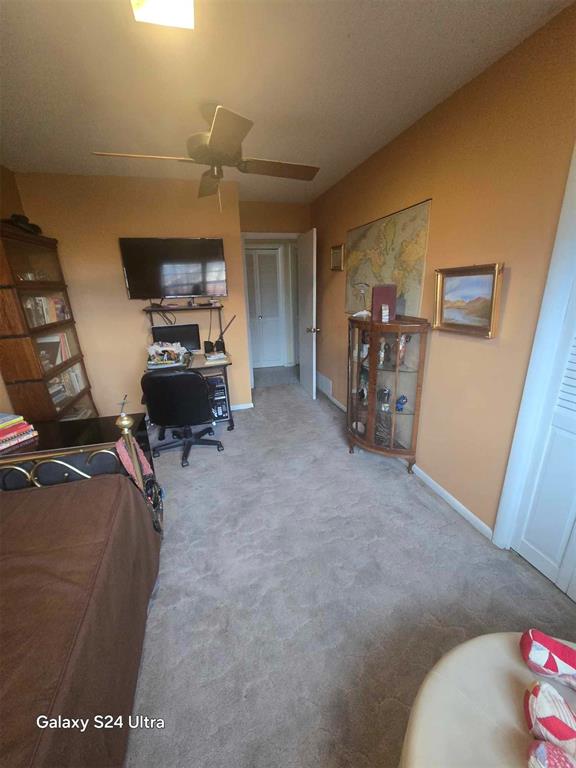 506 E Oklahoma St, Walters, OK 73572 - carpeted office featuring baseboards and a ceiling fan