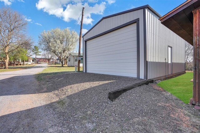 9872 N 2121st Pl, Butler, OK 73625 - garage featuring gravel driveway