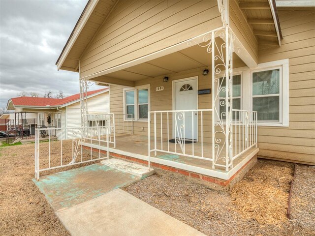 1604 NE Euclid St, Oklahoma City, OK 73117 - doorway to property with a porch