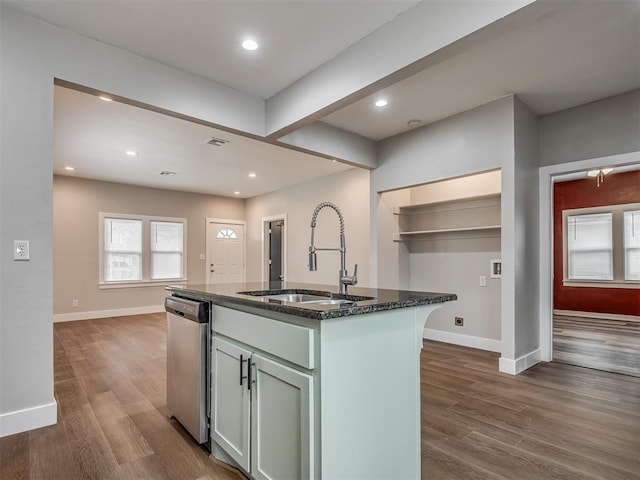 1604 NE Euclid St, Oklahoma City, OK 73117 - kitchen featuring dark wood-type flooring, baseboards, dishwasher, dark stone countertops, and a sink