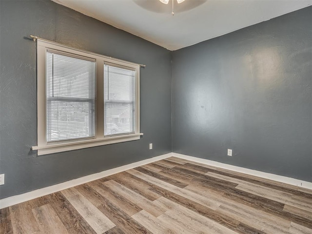 1604 NE Euclid St, Oklahoma City, OK 73117 - empty room with wood finished floors, baseboards, a textured wall, and ceiling fan