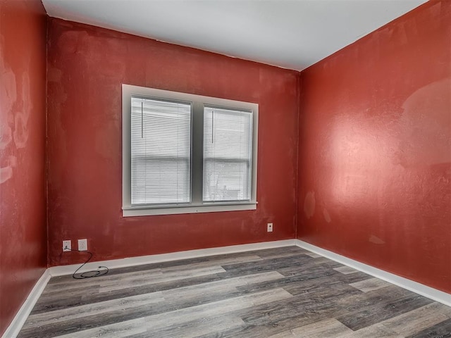 1604 NE Euclid St, Oklahoma City, OK 73117 - spare room with baseboards and wood finished floors