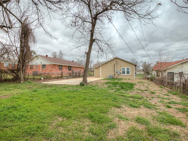 1604 NE Euclid St, Oklahoma City, OK 73117 - back of property featuring a lawn, a patio, and fence