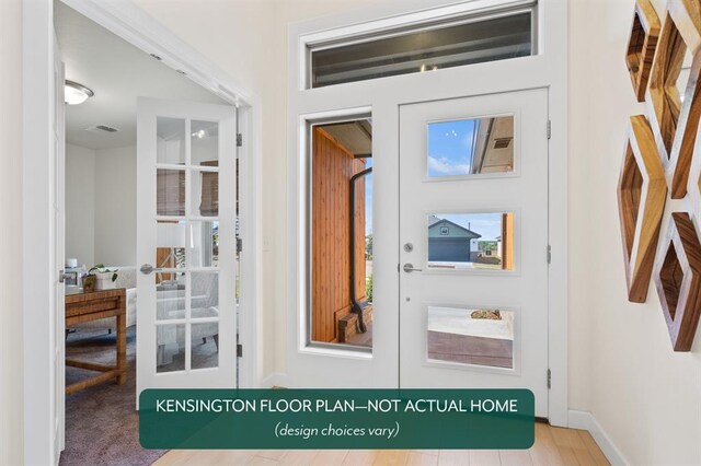 entrance to property featuring visible vents and french doors