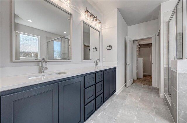 4201 Emery Dr, Edmond, OK 73034 - bathroom with a stall shower, double vanity, and a walk in closet