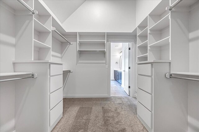 4201 Emery Dr, Edmond, OK 73034 - walk in closet featuring light carpet