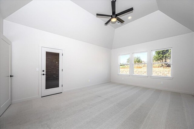 4201 Emery Dr, Edmond, OK 73034 - spare room featuring lofted ceiling, light carpet, a ceiling fan, and baseboards