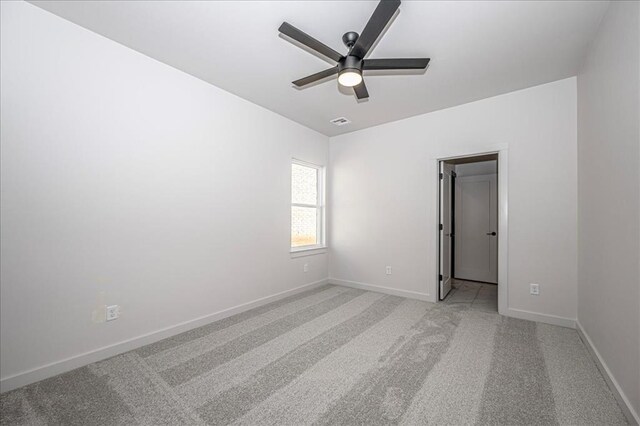 4201 Emery Dr, Edmond, OK 73034 - spare room with ceiling fan, light carpet, and baseboards