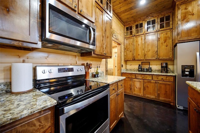 kitchen featuring appliances with stainless steel finishes, wooden ceiling, concrete floors, brown cabinets, and glass insert cabinets
