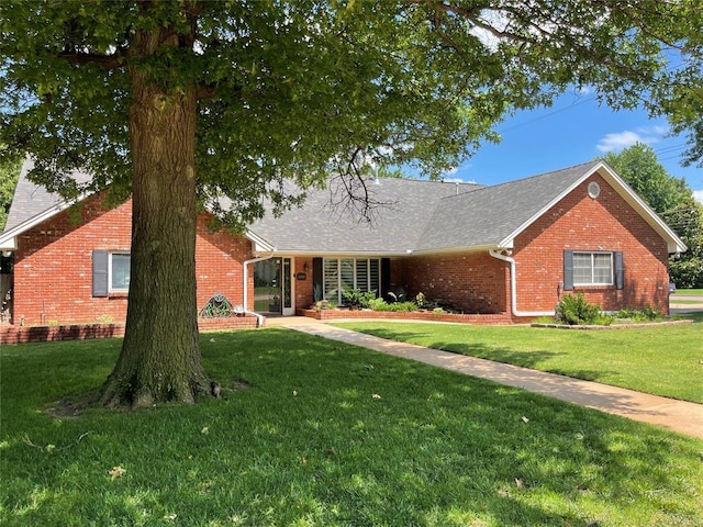 10900 Willow Grove Rd, Oklahoma City, OK 73120 - single story home with brick siding, a front yard, and a shingled roof