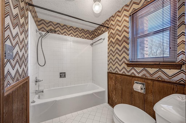 10900 Willow Grove Rd, Oklahoma City, OK 73120 - bathroom with toilet, wallpapered walls, shower / washtub combination, tile patterned flooring, and a textured ceiling