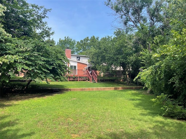 10900 Willow Grove Rd, Oklahoma City, OK 73120 - view of green lawn with a wooden deck and stairway