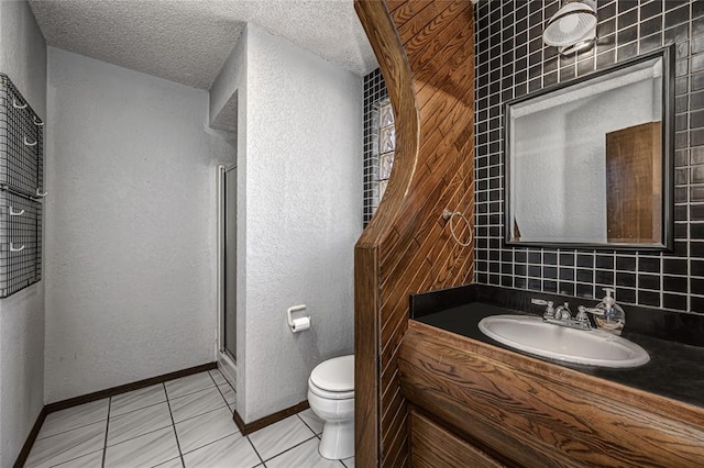 10900 Willow Grove Rd, Oklahoma City, OK 73120 - bathroom with toilet, vanity, a shower stall, a textured ceiling, and tile patterned floors