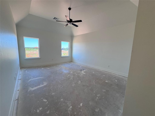 unfurnished room with visible vents, concrete floors, a ceiling fan, baseboards, and vaulted ceiling
