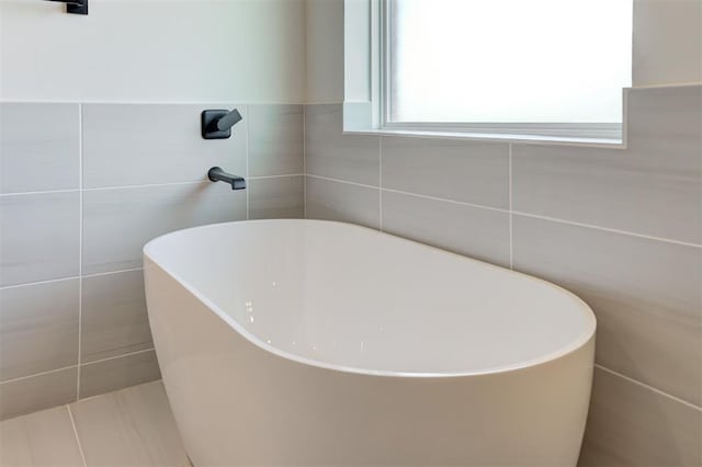 9321 NW 147th Ter, Yukon, OK 73099 - full bath featuring tile walls and a freestanding tub
