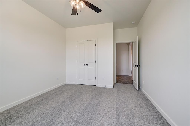 9321 NW 147th Ter, Yukon, OK 73099 - unfurnished bedroom with carpet, a closet, and a ceiling fan