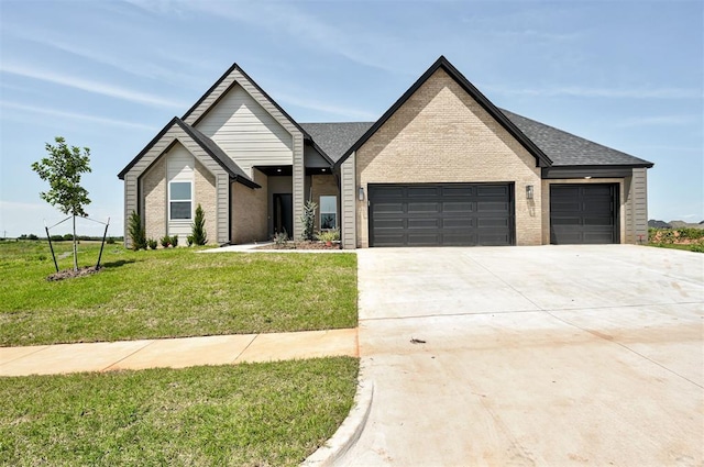 9321 NW 147th Ter, Yukon, OK 73099 - view of front of house featuring a garage, brick siding, driveway, a front yard, and roof with shingles