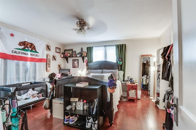 1011 NW 31st St, Oklahoma City, OK 73118 - bedroom with ceiling fan, wood finished floors, and ornamental molding