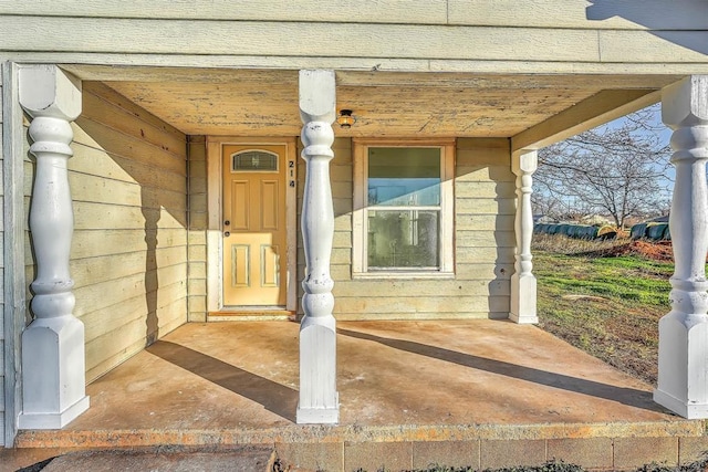 doorway to property with a porch