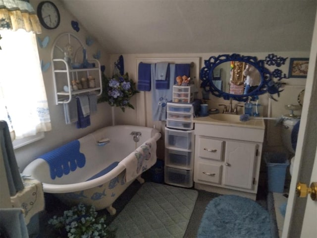 2005 E Cherokee Ave, Enid, OK 73701 - full bath featuring lofted ceiling, vanity, and a freestanding tub