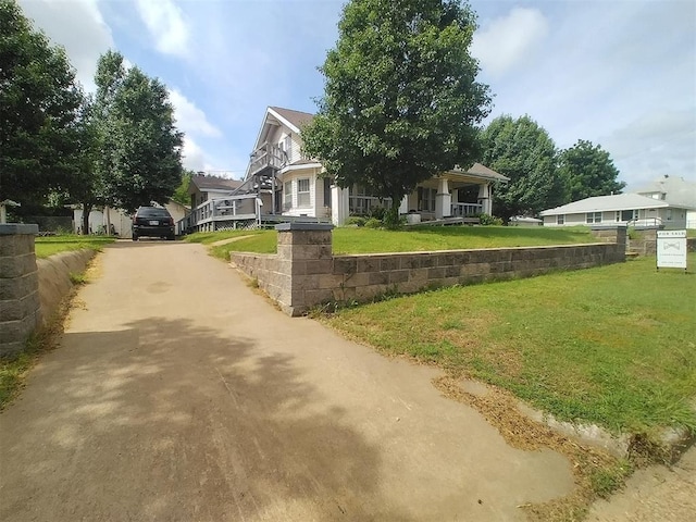 2005 E Cherokee Ave, Enid, OK 73701 - view of front of property with driveway, a front yard, and a porch