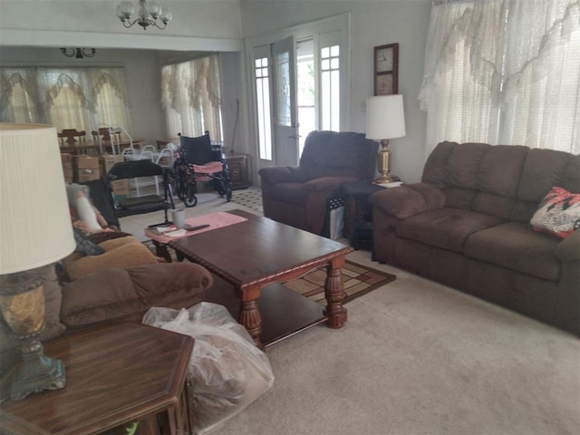 2005 E Cherokee Ave, Enid, OK 73701 - carpeted living room with a chandelier