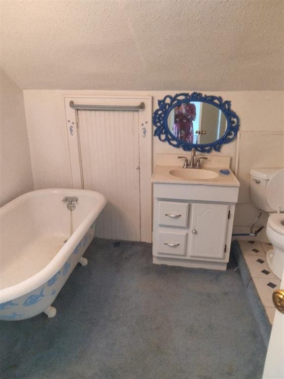 2005 E Cherokee Ave, Enid, OK 73701 - bathroom with a freestanding tub, a textured ceiling, and vanity